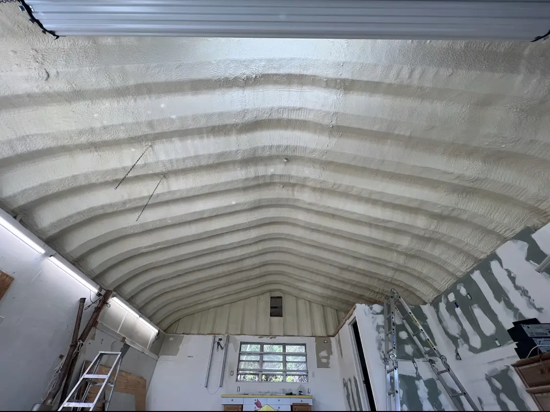 Spray polyurethane foam applied to the underside of a metal roof deck in Williamstown